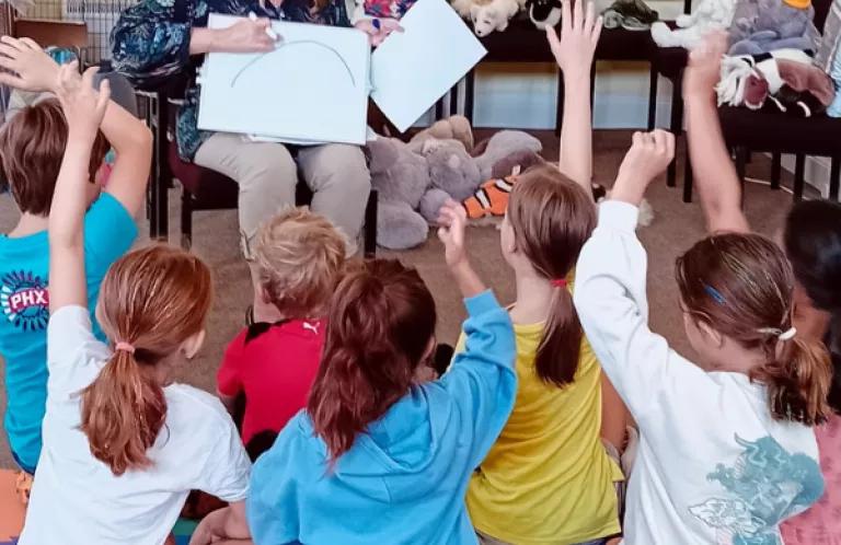 Group of children listen to a story