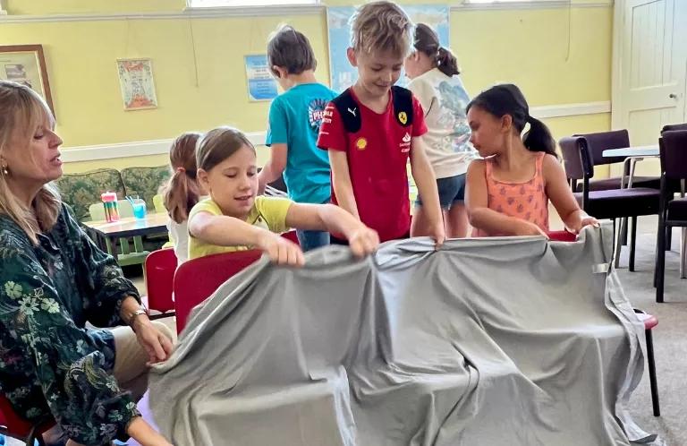 Children play a game at holiday club