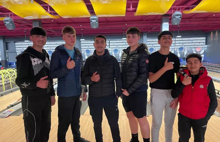 group of boys at a bowling alley