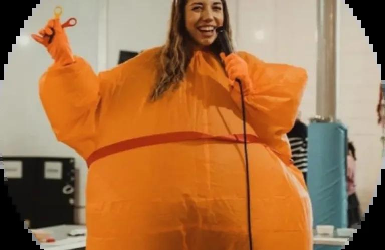 Women dressed as a Christingle (orange)