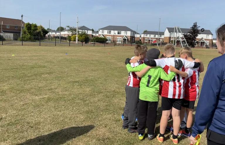 a group in a team huddle