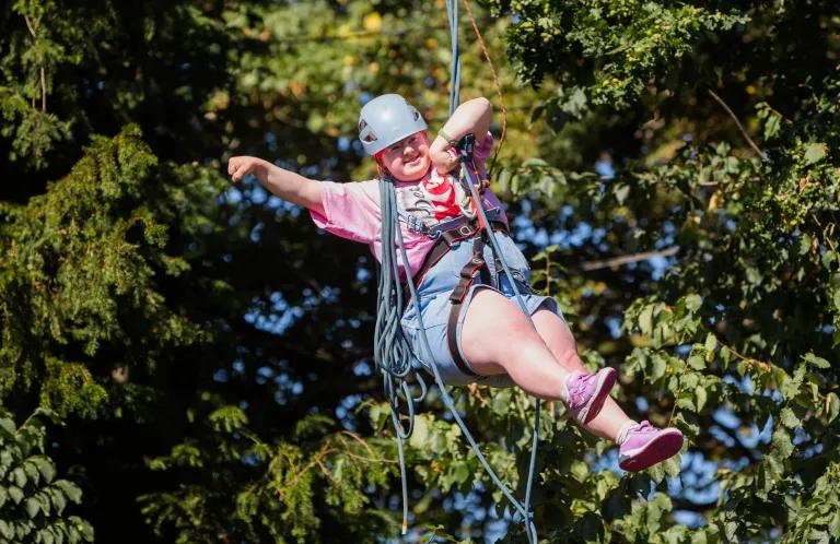 A girl on a zipline.