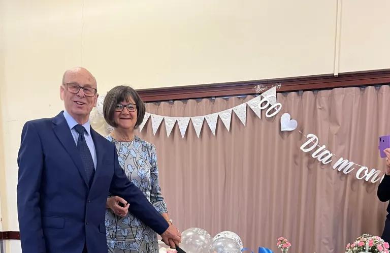 Elspeth Edwin Payne cutting anniversary cake
