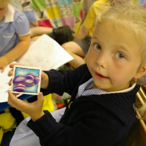 Girl showing her picture
