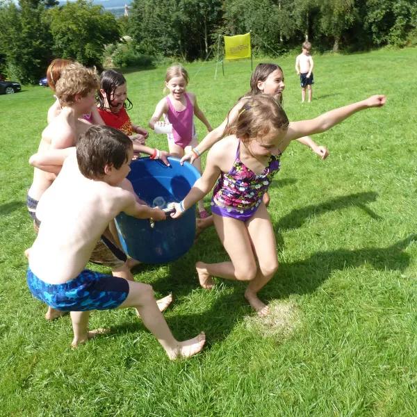 Group of Children with Bucket of Water - Summer Fun