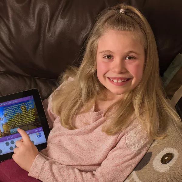 Girl playing Guardians of Ancora