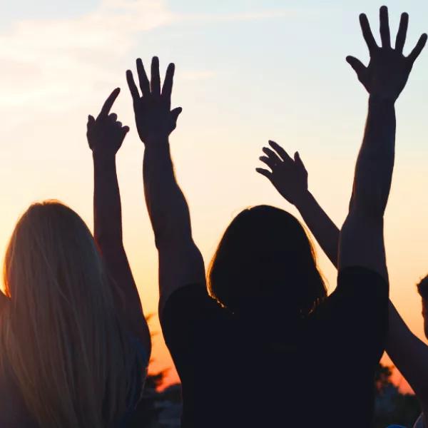 Hands in the air with sun