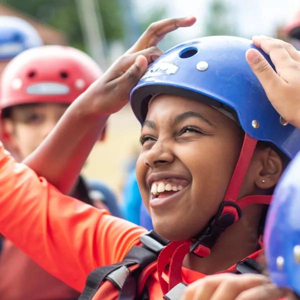 child smiling with helmet