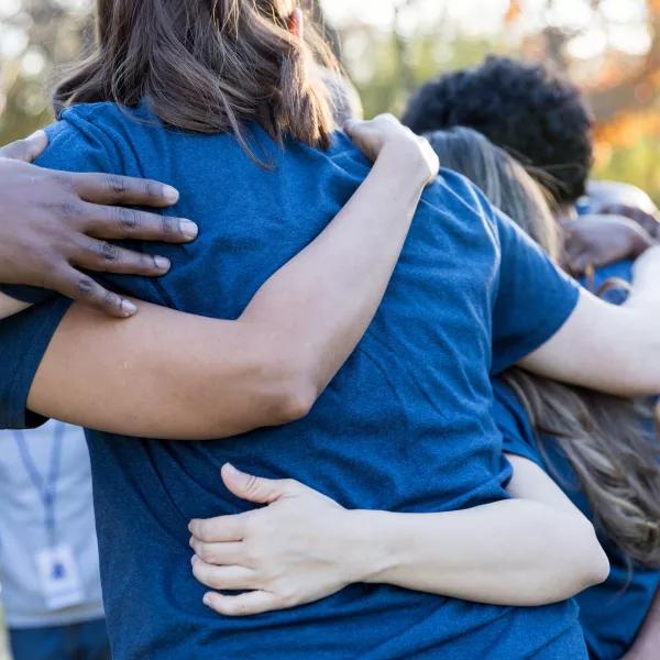 Volunteers hugging
