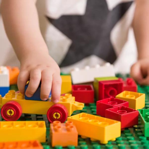 Child playing with duplo