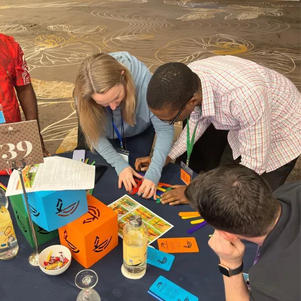Teams working on a table project