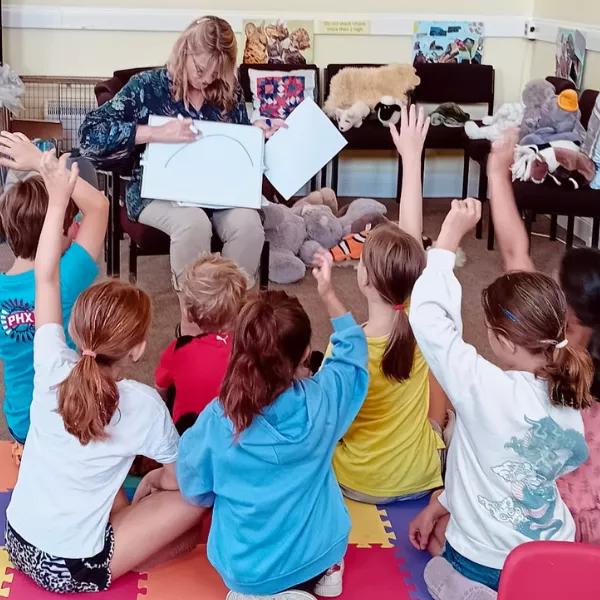 Group of children listen to a story