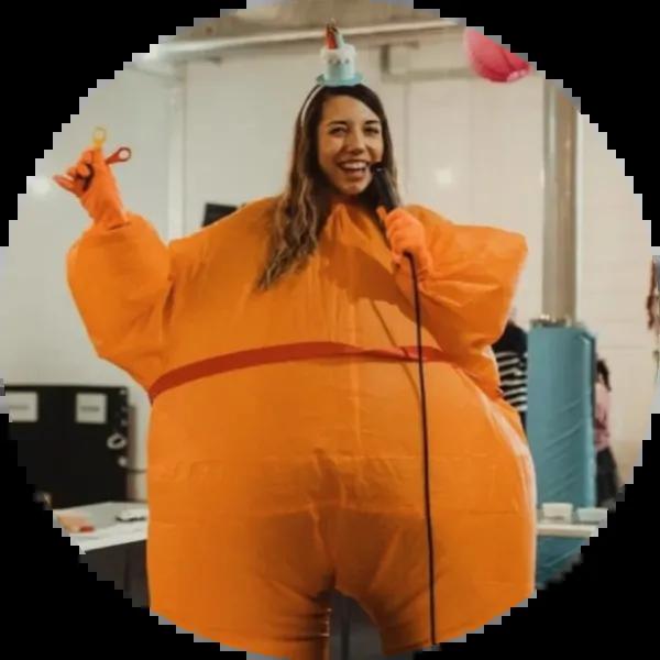 Women dressed as a Christingle (orange)
