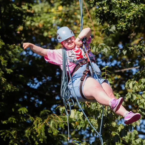 A girl on a zipline.