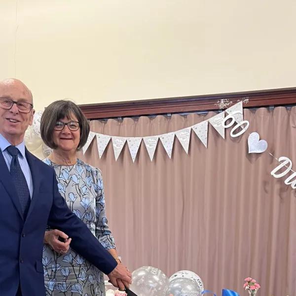 Elspeth Edwin Payne cutting anniversary cake