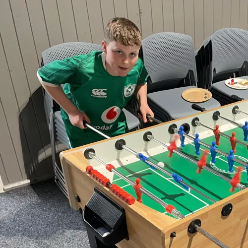 Boy playing table football