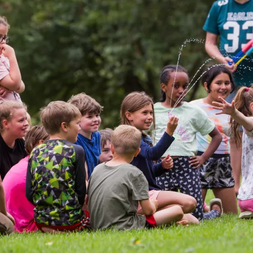 Group of kids sat down playing
