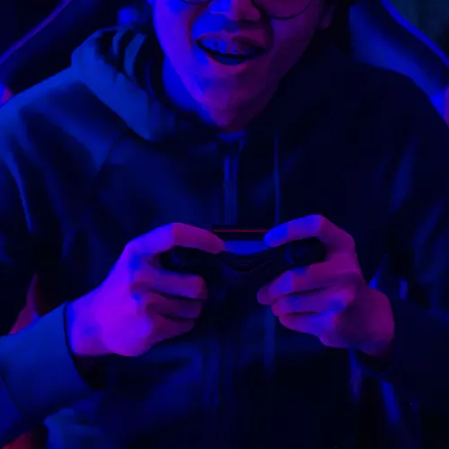 Youth with a games console