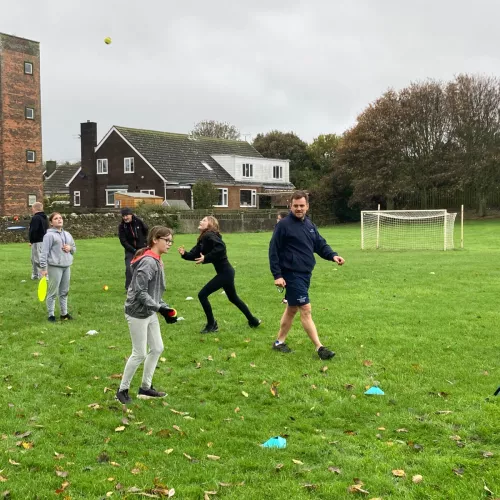 children playing sport with sports team